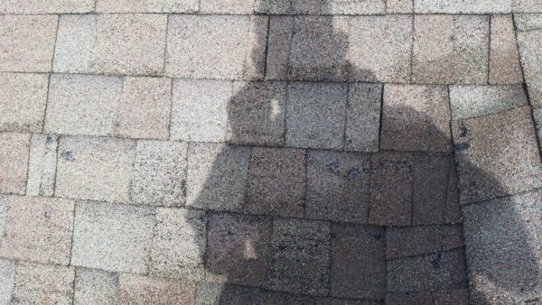 Picture of shingle ware during roof inspection